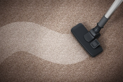 Vacuum cleaner cleaning dirty carpet. 3D illustration